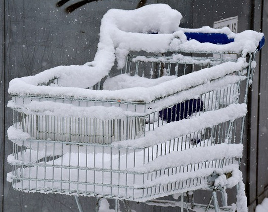 Snow covered shopping cart.