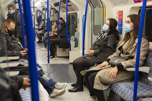 People riding on a subway.