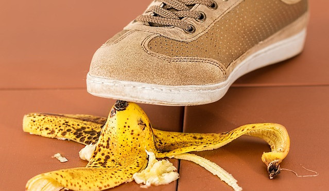Shoe stepping on banana.